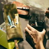 The SUPERIOR LABOR Glove Leather - Tool Holder

The discontinued tool holder&nbsp;is back with a redesigned construction.

The raw-cut edges are accented with a brass tag, and the interior logo is finished with gold foil.&nbsp;The result is a refined, elegant look that still feels light and airy.&nbsp;It’s perfect for carrying pens and other everyday tools.

Size: W10.5×H15.5×D2cm
About the Leather – Japanese Glove Leather

Made from durable and supple Japanese glove leather, known for its lightness and str
