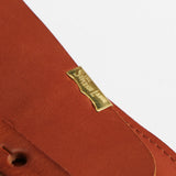 The SUPERIOR LABOR Glove Leather - Tool Holder

The discontinued tool holder&nbsp;is back with a redesigned construction.

The raw-cut edges are accented with a brass tag, and the interior logo is finished with gold foil.&nbsp;The result is a refined, elegant look that still feels light and airy.&nbsp;It’s perfect for carrying pens and other everyday tools.

Size: W10.5×H15.5×D2cm
About the Leather – Japanese Glove Leather

Made from durable and supple Japanese glove leather, known for its lightness and str