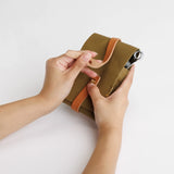 The SUPERIOR LABOR Glove Leather - Tool Holder

The discontinued tool holder&nbsp;is back with a redesigned construction.

The raw-cut edges are accented with a brass tag, and the interior logo is finished with gold foil.&nbsp;The result is a refined, elegant look that still feels light and airy.&nbsp;It’s perfect for carrying pens and other everyday tools.

Size: W10.5×H15.5×D2cm
About the Leather – Japanese Glove Leather

Made from durable and supple Japanese glove leather, known for its lightness and str