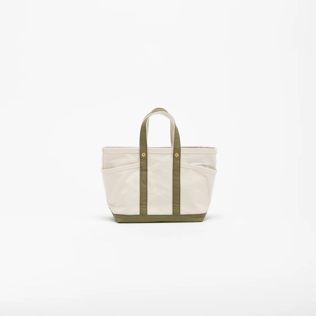 The SUPERIOR LABOR Mini Tote Bag

A simple, timeless canvas bag designed for everyday life.

Its compact size is just right for daily essentials, while the four outer pockets keep your glasses, keys, favorite pens, or notebook neatly organized.

They make it easy to stay tidy and add a touch of extra storage without changing the clean look of the bag.

Size: W37×H23.5×D12.5cm
Canvas Products
Painted areas may be affected by friction or water, which can cause color transfer. Please handle with care.