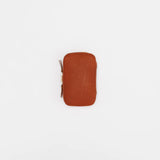 We crafted this leather case for those who love to write —for people who value the quiet moments spent with pen and paper.

Open it up, and on the right side, every surface that touches your precious pens is lined with soft suede, gently protecting them from scratches.&nbsp;On the left, two rows of pockets hold your memo pads, casual pens, or other writing companions, keeping everything neatly in place and ready whenever inspiration strikes.

Size: W13×H20×D4.5cm
About the Leather – Japanese Glove Leather

