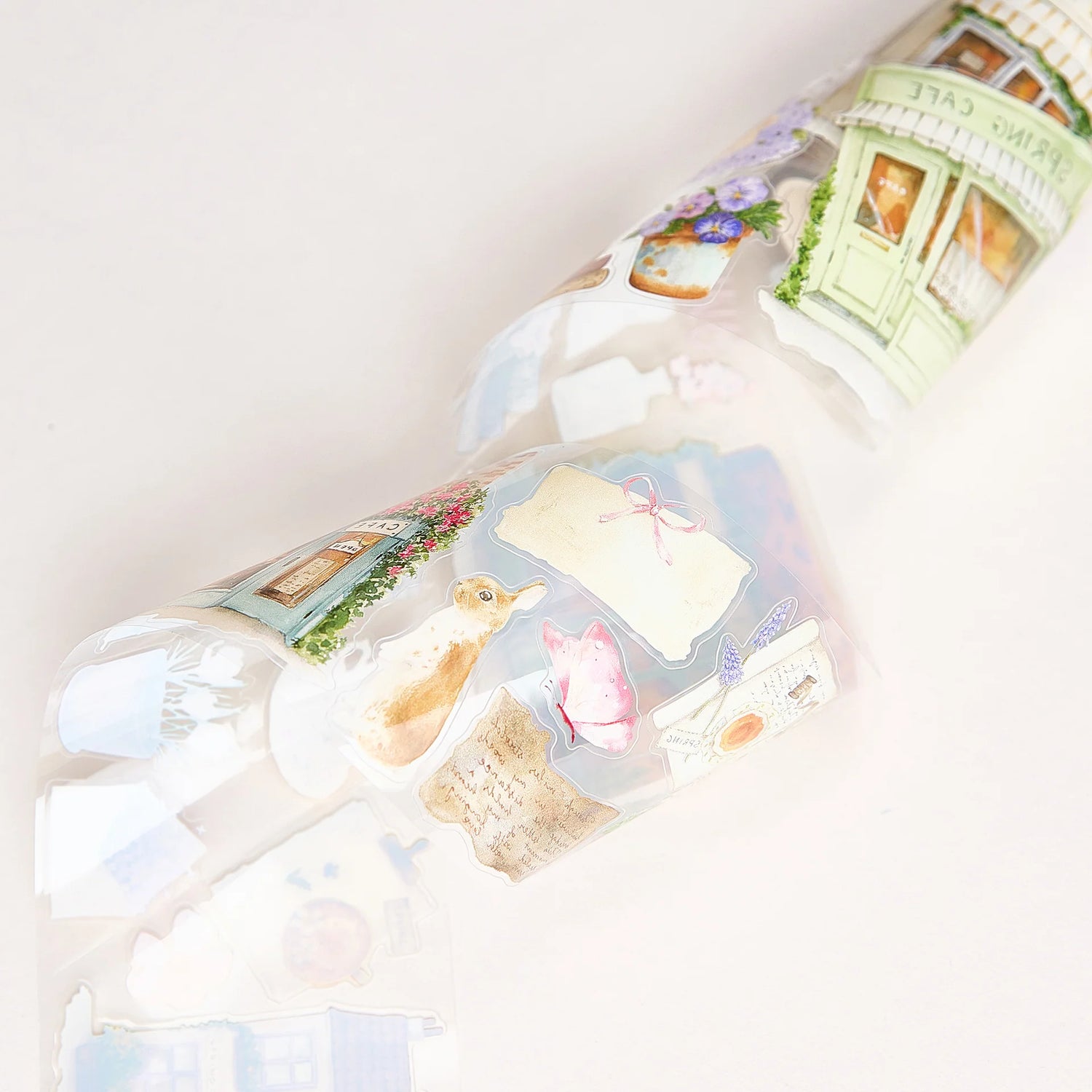 Celebrate the season of new beginnings with a design that marries architecture and nature. Our Spring Café Wide Tape is a watercolor love letter to the season, featuring quaint cafe facades almost hidden behind explosions of pastel bouquets and greenery.