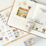 Celebrate the season of new beginnings with a design that marries architecture and nature. Our Spring Café Wide Tape is a watercolor love letter to the season, featuring quaint cafe facades almost hidden behind explosions of pastel bouquets and greenery.