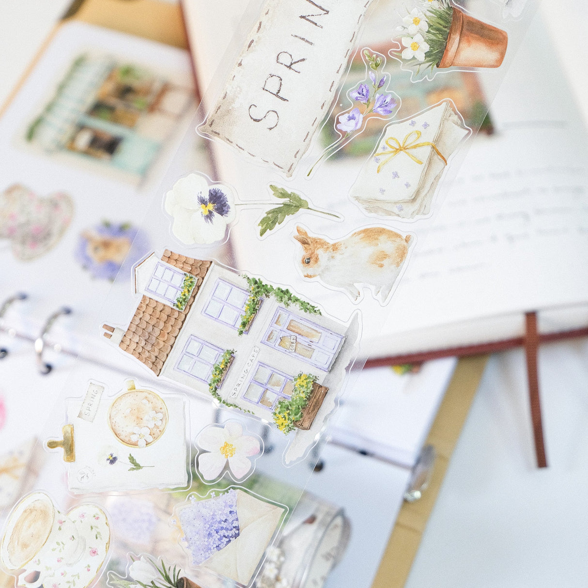 Celebrate the season of new beginnings with a design that marries architecture and nature. Our Spring Café Wide Tape is a watercolor love letter to the season, featuring quaint cafe facades almost hidden behind explosions of pastel bouquets and greenery.