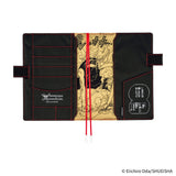 The chic cover features an illustration which is silk-screen printed onto a black background. The red stitching on the edge and the bookmark in a matching shade serve as bold accents.