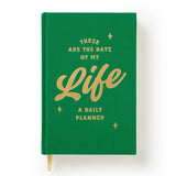 This undated daily planner gives each day a full page. It’s part planner, part journal, part trivia master. We’ve already filled in fixed holidays, celebrity birthdays, and quirky facts—just mark the day of the week and get going. Features a cloth-bound cover with embossed foil artwork, a ribbon bookmark, and 226 pages packed with charm, from hourly planning to note grids and surprising facts. Every page includes something unexpected—random holidays, trivia, and more. It's like your day got photobombed by a
