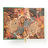 This undated daily planner gives each day a full page. It’s part planner, part journal, part trivia master. We’ve already filled in fixed holidays, celebrity birthdays, and quirky facts—just mark the day of the week and get going. Features a cloth-bound cover with embossed foil artwork, a ribbon bookmark, and 226 pages packed with charm, from hourly planning to note grids and surprising facts. Every page includes something unexpected—random holidays, trivia, and more. It's like your day got photobombed by a