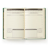 This undated daily planner gives each day a full page. It’s part planner, part journal, part trivia master. We’ve already filled in fixed holidays, celebrity birthdays, and quirky facts—just mark the day of the week and get going. Features a cloth-bound cover with embossed foil artwork, a ribbon bookmark, and 226 pages packed with charm, from hourly planning to note grids and surprising facts. Every page includes something unexpected—random holidays, trivia, and more. It's like your day got photobombed by a