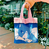 The Co-Knitty bag is a small hand carry bag perfect for your necessities such as phone and wallet.

Recycled polyester (one tote bag is made from approximately 1.5 recycled plastic bottles)&nbsp;
A cute hand carry at the size of 20 x 20cm x 6.5cm(depth), 188g
Easily clean the bag by tossing it into the washing machine (laundry net recommended)
Wrinkle free, so feel free to fold away when you don't need it!
Made locally in Japan