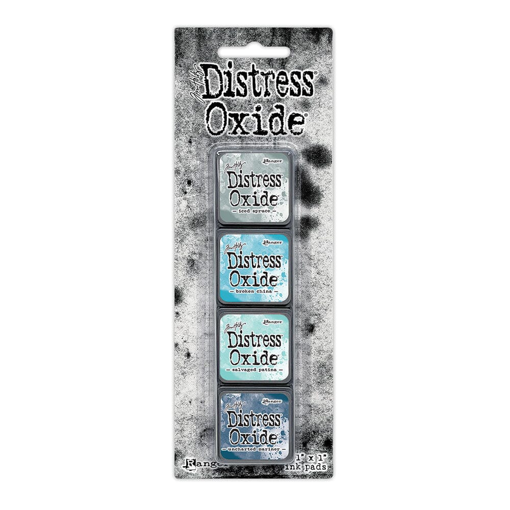 Tim Holtz Distress Mini Oxide Ink Pads are a collection of 1 x 1 cubes featuring water-reactive dye &  pigment ink fusion that creates an oxidized effect when sprayed with water.