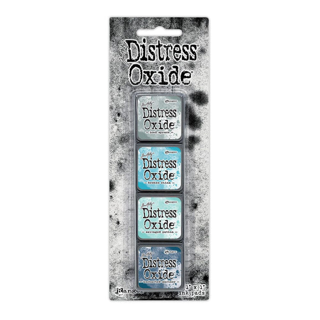 Tim Holtz Distress Mini Oxide Ink Pads are a collection of 1 x 1 cubes featuring water-reactive dye &  pigment ink fusion that creates an oxidized effect when sprayed with water.