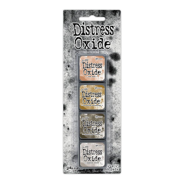 Tim Holtz Distress Mini Oxide Ink Pads are a collection of 1 x 1 cubes featuring water-reactive dye & pigment ink fusion that creates an oxidized effect when sprayed with water.