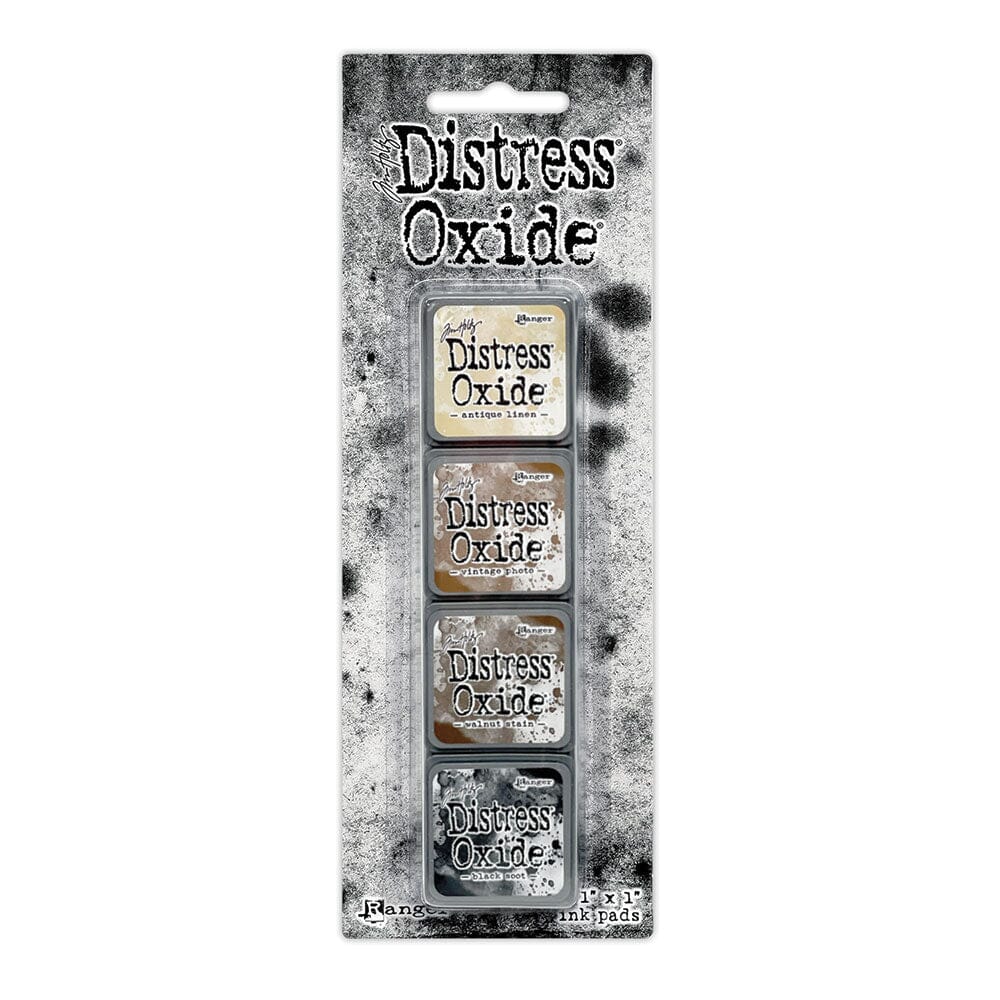 Tim Holtz Distress Mini Oxide Ink Pads are a collection of 1 x 1 cubes featuring water-reactive dye & pigment ink fusion that creates an oxidized effect when sprayed with water.
