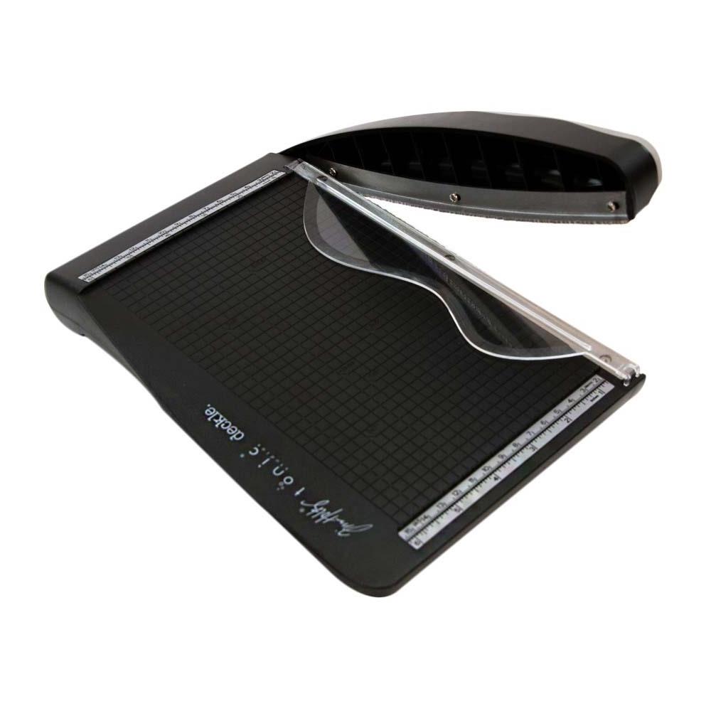 The Tim Holtz Deckle Torn Edge Trimmer gives your projects the perfect distressed deckle edge effect with maximum control and precision. Designed to provide effortlessly repeatable deckle effects, this new cutting tool from Tim Holtz and Tonic Studios is essential for any crafter looking to bring life to their next design. Combine with different papers and card stock for varying torn edge effects.