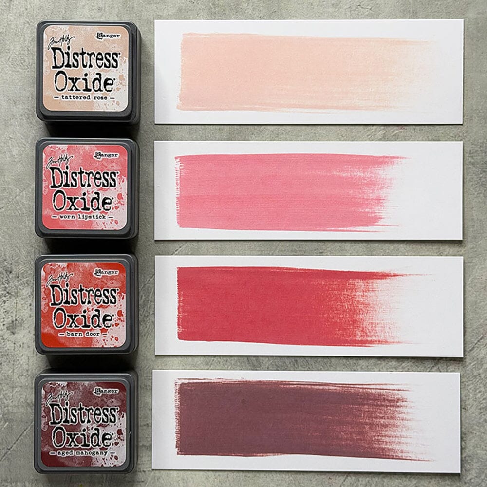 Tim Holtz Distress Mini Oxide Ink Pads are a collection of 1 x 1 cubes featuring water-reactive dye & pigment ink fusion that creates an oxidized effect when sprayed with water