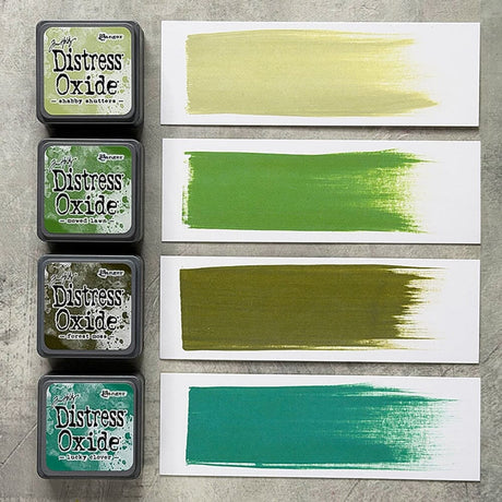 Tim Holtz Distress Mini Oxide Ink Pads are a collection of 1 x 1 cubes featuring water-reactive dye & pigment ink fusion that creates an oxidized effect when sprayed with water.