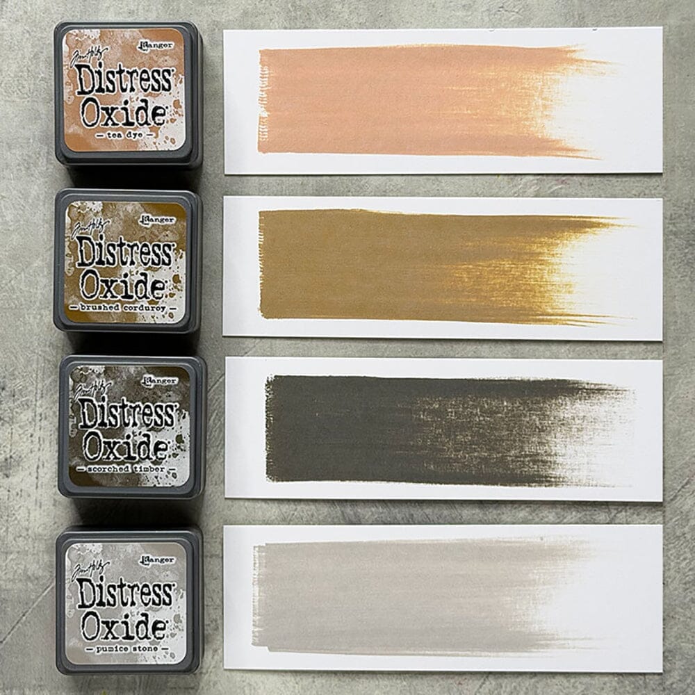Tim Holtz Distress Mini Oxide Ink Pads are a collection of 1 x 1 cubes featuring water-reactive dye & pigment ink fusion that creates an oxidized effect when sprayed with water.
