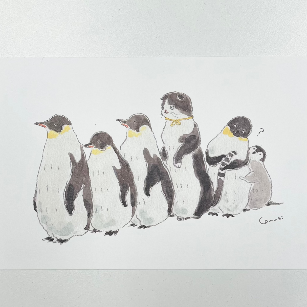 This adorable postcard features a cat trying to blend in with a row of penguins. It was illustrated by artist Tokoro Komugi who is known for their soft style of illustration featuring animals.

4in x 5.8in