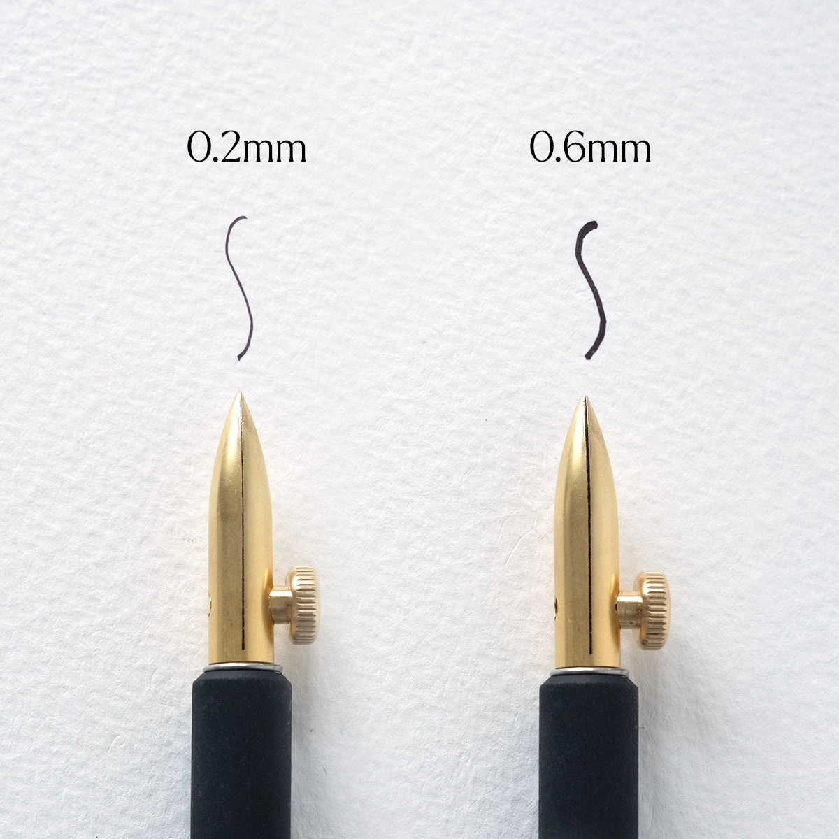 An experimental calligraphy nib. This nib is a delight for illustrators and calligraphers, offering the ability to adjust the nib for a wide range of stunning line variations. With a simple twist of the thumb screw, you can produce broader or finer lines, or change the nib's angle to the page to create rich, thick strokes.