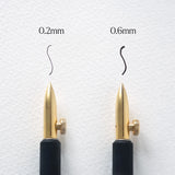 An experimental calligraphy nib. This nib is a delight for illustrators and calligraphers, offering the ability to adjust the nib for a wide range of stunning line variations. With a simple twist of the thumb screw, you can produce broader or finer lines, or change the nib's angle to the page to create rich, thick strokes.