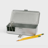 Toyo Steel Box Silver Metal pencil box with a pencil and sharpener on a white background