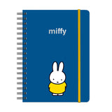 Plan out your year with Miffy! This Undated Tri-Tab Planner is your go-to for year-round organization—start anytime, no dates required! With three cute tabbed dividers, you can easily flip between monthly spreads, weekly planning, and notes. Plus, full-color stickers make tracking your to-dos fun and easy! Each section features a handy pocket for receipts or lists, and the wire-o binding lets it lie flat as you plan. The elastic band keeps everything secure—and doubles as a page marker! Planning just got a 