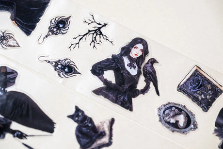 tep into the world of Victorian elegance with this unique transparent PET tape by CoraCreaCrafts. Designed with an intricate mix of gothic-inspired stickers, this tape features a 100cm repeat loop, showcasing a variety of detailed designs. The glossy finish adds a sophisticated shine, making it perfect for adding a touch of vintage charm to your creative projects.
 