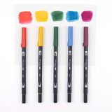 Learn to use Tombow Dual Brush Pens to easily create watercolor art with the Tombow Watercolor Set. Includes a pamphlet with helpful tips and all the tools you need to start blending and mixing colors. Each set includes 5 Dual Brush Pens, Medium Water Brush, MONO Drawing Pencil, MONO Twin Permanent Marker, MONO Plastic Eraser, Blending Palette, Watercolor Guide, and Mixing Chart. Dual Brush Pen Colors Included: 885 Warm Red, 993 Chrome Orange, 249 Hunter Green, 526 True Blue, 757 Port Red.