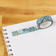 Waterfall Floral Washi Tape

Our washi tape is made for paper lovers, pen pals, and anyone who gets butterflies in the stationery aisle. Perfect for journaling, scrapbooking, decorating envelopes, or adding a personal touch to planners and calendars. It's gentle on paper, easy to tear by hand, and removable without leaving residue, so you can rearrange, redo, and re-stick as needed.

Design Features:&nbsp;

Each roll measures 15mm wide on a 10m roll
Full color repeating pattern
Washi tape dispenser packagin