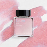 A tender rose quartze hue is veiled with graceful bluish tones, where silver and sapphire shimmer cast a cool, delicate sparkle across the surface, reflecting Emma's innocence and immaturity in how she so easily judged love.