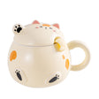 This adorable cat mug includes a matching lid and spoon!

Size: 4"H
Capacity: 15 fl oz
Material: Stoneware
Origin: China