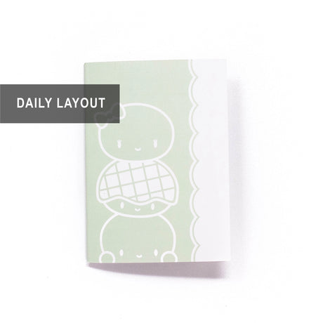 Use this notebook for your daily journaling or planning, as an insert in your B6 planner, or as a standalone notebook for doodling, scrapbooking, or memory keeping! A bun totem of the Steam Team's Charlie, Laila, and Bolo Bob can be seen peeking out of the front, back, and inside covers ;)

SPECIFICATIONS

SIZE: 5" wide and 7" tall, slotting perfectly into the strings of any B6 Traveler's Notebook (TN) cover