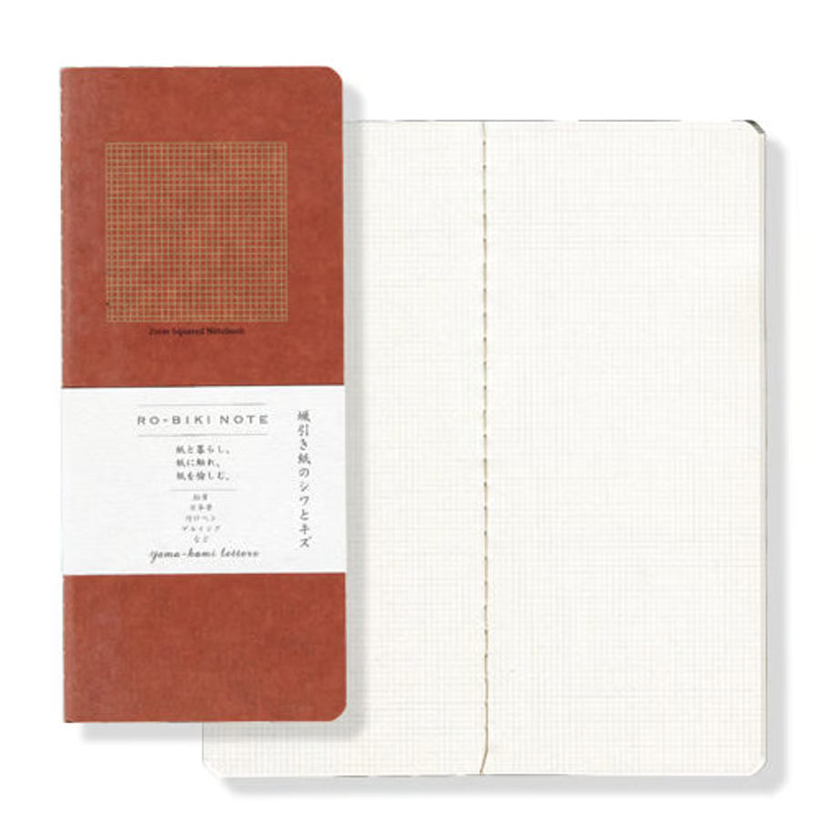 The RO‑BIKI Note is a beautifully crafted Japanese notebook known for its distinctive waxed paper cover, which gains character the more you use it. Over time, the cover softens, develops a natural patina, and becomes uniquely yours—making every notebook feel personal and well‑loved.

Inside, you’ll find high‑quality 2mm square grid paper ideal for writing, sketching, planning, or journaling. Its compact size makes it perfect for everyday carry, while the durable construction ensures it holds up to frequent 