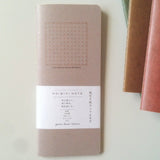 The RO‑BIKI Note is a beautifully crafted Japanese notebook known for its distinctive waxed paper cover, which gains character the more you use it. Over time, the cover softens, develops a natural patina, and becomes uniquely yours—making every notebook feel personal and well‑loved.

Inside, you’ll find high‑quality 5mm reticle pattern paper ideal for writing, sketching, planning, or journaling. Its compact size makes it perfect for everyday carry, while the durable construction ensures it holds up to frequ
