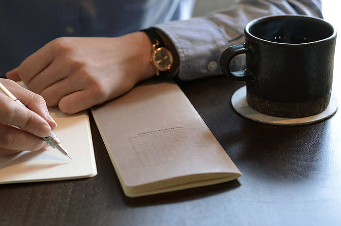 The RO‑BIKI Note is a beautifully crafted Japanese notebook known for its distinctive waxed paper cover, which gains character the more you use it. Over time, the cover softens, develops a natural patina, and becomes uniquely yours—making every notebook feel personal and well‑loved.

Inside, you’ll find high‑quality 5mm reticle pattern paper ideal for writing, sketching, planning, or journaling. Its compact size makes it perfect for everyday carry, while the durable construction ensures it holds up to frequ