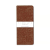 The RO‑BIKI Note is a beautifully crafted Japanese notebook known for its distinctive waxed paper cover, which gains character the more you use it. Over time, the cover softens, develops a natural patina, and becomes uniquely yours—making every notebook feel personal and well‑loved.

Inside, you’ll find high‑quality blank paper ideal for writing, sketching, planning, or journaling. Its compact size makes it perfect for everyday carry, while the durable construction ensures it holds up to frequent use.

Thes