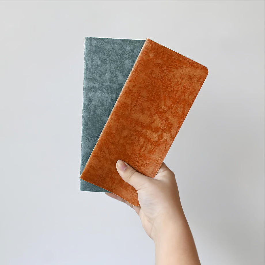 The RO‑BIKI Note is a beautifully crafted Japanese notebook known for its distinctive waxed paper cover, which gains character the more you use it. Over time, the cover softens, develops a natural patina, and becomes uniquely yours—making every notebook feel personal and well‑loved.

Inside, you’ll find high‑quality blank paper ideal for writing, sketching, planning, or journaling. Its compact size makes it perfect for everyday carry, while the durable construction ensures it holds up to frequent use.

Thes