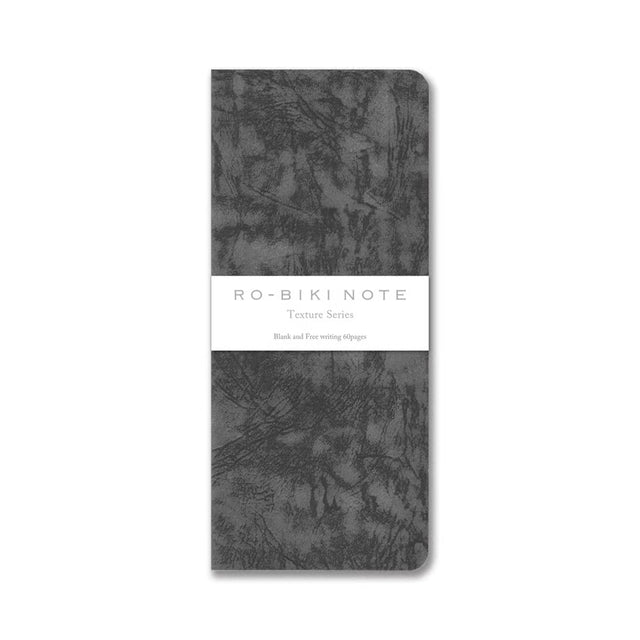 The RO‑BIKI Note is a beautifully crafted Japanese notebook known for its distinctive waxed paper cover, which gains character the more you use it. Over time, the cover softens, develops a natural patina, and becomes uniquely yours—making every notebook feel personal and well‑loved.

Inside, you’ll find high‑quality blank paper ideal for writing, sketching, planning, or journaling. Its compact size makes it perfect for everyday carry, while the durable construction ensures it holds up to frequent use.

Thes