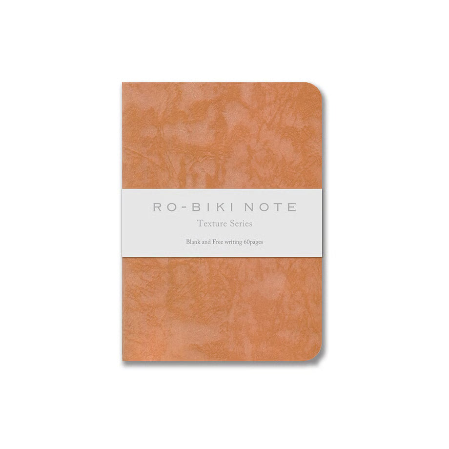 The RO‑BIKI Note is a beautifully crafted Japanese notebook known for its distinctive waxed paper cover, which gains character the more you use it. Over time, the cover softens, develops a natural patina, and becomes uniquely yours—making every notebook feel personal and well‑loved.