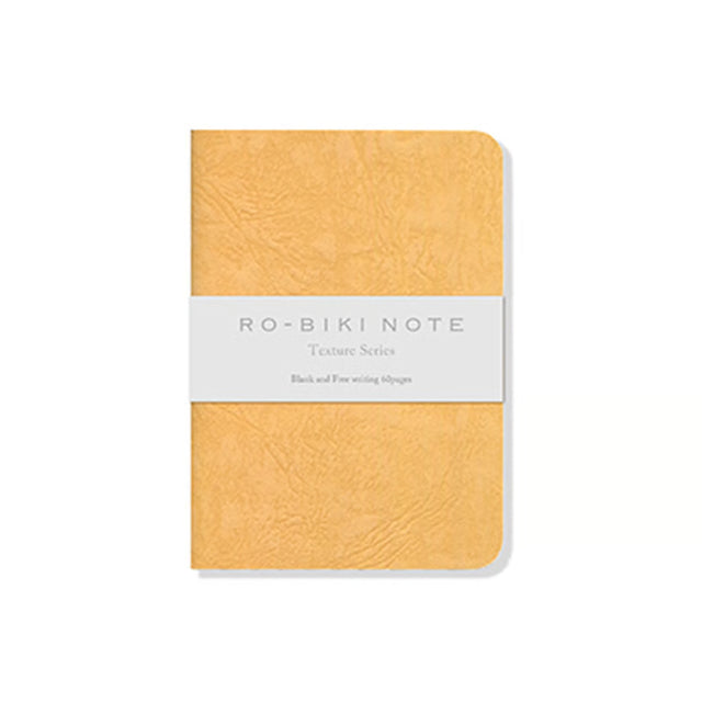 The RO‑BIKI Note is a beautifully crafted Japanese notebook known for its distinctive waxed paper cover, which gains character the more you use it. Over time, the cover softens, develops a natural patina, and becomes uniquely yours—making every notebook feel personal and well‑loved.