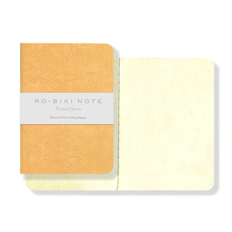 The RO‑BIKI Note is a beautifully crafted Japanese notebook known for its distinctive waxed paper cover, which gains character the more you use it. Over time, the cover softens, develops a natural patina, and becomes uniquely yours—making every notebook feel personal and well‑loved.