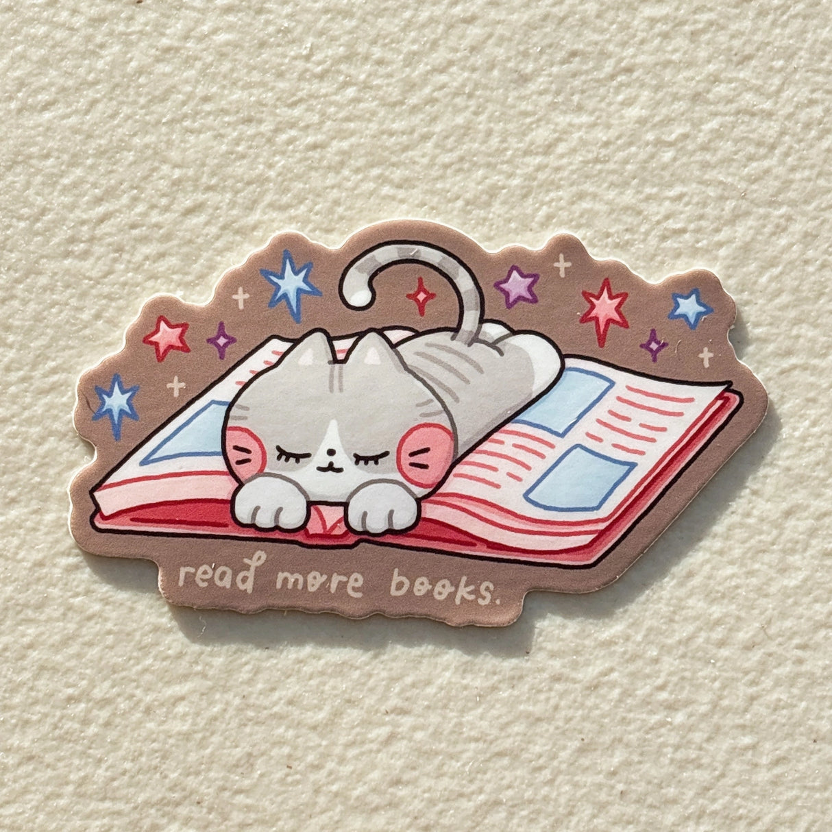 StickyRiceCo Vinyl Sticker - Read More Books Cat on Book