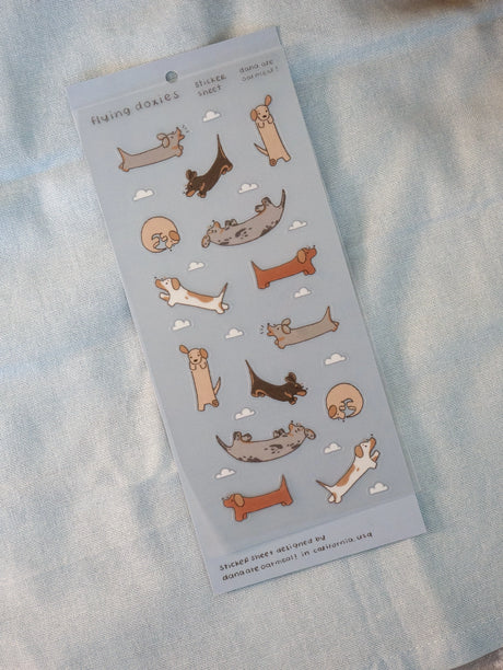 There, up in the sky! Dachshunds everywhere!

Kiss cut PET sticker sheet

Includes 1 sheet 7.5" x 3.5"