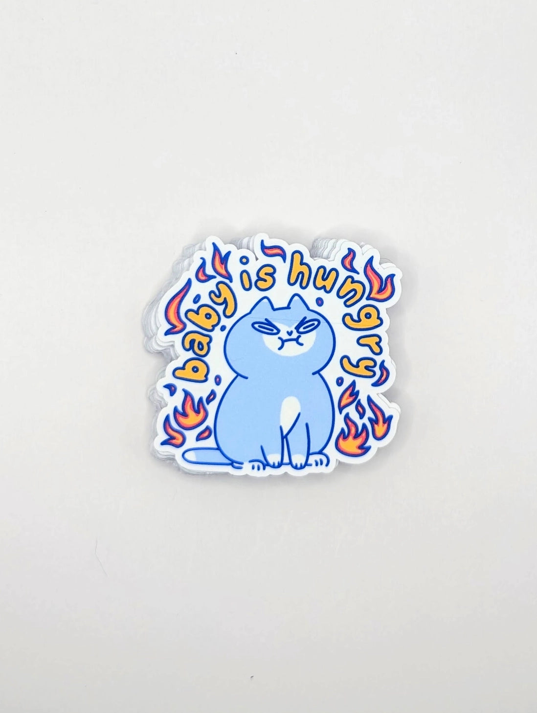 Perfect for those who understand the power of a hangry kitty, this 2" sticker features an adorably angry cat surrounded by vibrant flames. Made from durable, waterproof vinyl, this sticker is built to withstand the elements—whether you stick it on your water bottle, laptop, or anywhere else you want to show off your sassy side. Add a touch of attitude and humor to your collection with this cute yet fiery design!