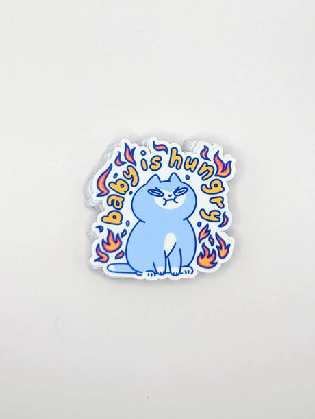 Perfect for those who understand the power of a hangry kitty, this 2" sticker features an adorably angry cat surrounded by vibrant flames. Made from durable, waterproof vinyl, this sticker is built to withstand the elements—whether you stick it on your water bottle, laptop, or anywhere else you want to show off your sassy side. Add a touch of attitude and humor to your collection with this cute yet fiery design!