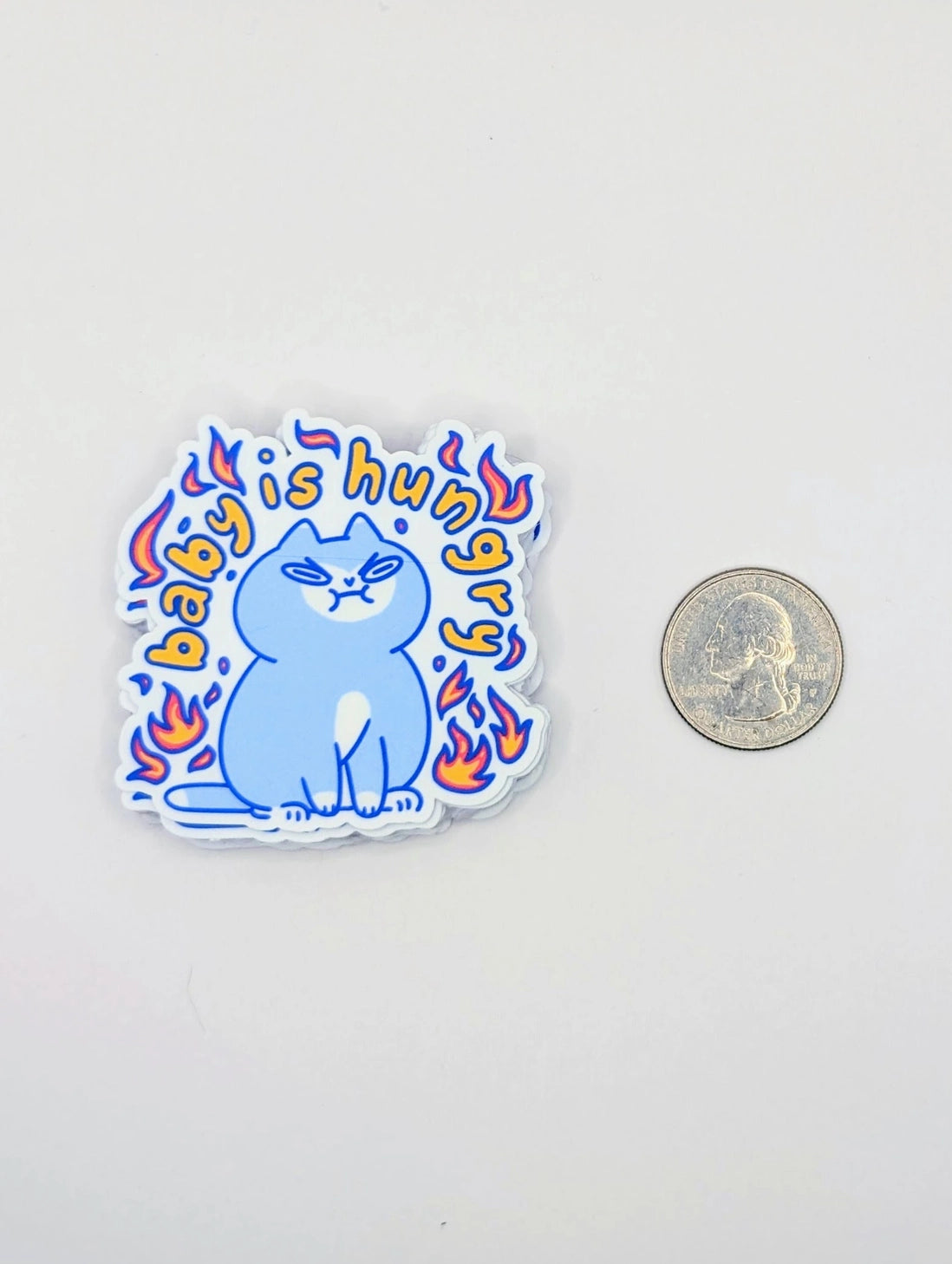 Perfect for those who understand the power of a hangry kitty, this 2" sticker features an adorably angry cat surrounded by vibrant flames. Made from durable, waterproof vinyl, this sticker is built to withstand the elements—whether you stick it on your water bottle, laptop, or anywhere else you want to show off your sassy side. Add a touch of attitude and humor to your collection with this cute yet fiery design!