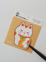 Lucky Cat Vinyl Sticker by natamori

✿ approx. 4.5 × 6.5 cm
✿ on a 3" × 3.5" sheet, easy to peel and stick
✿ matte vinyl sticker
✿ water- and scratch-resistant