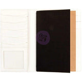 Includes one bonded leather cover and two blank notebooks.