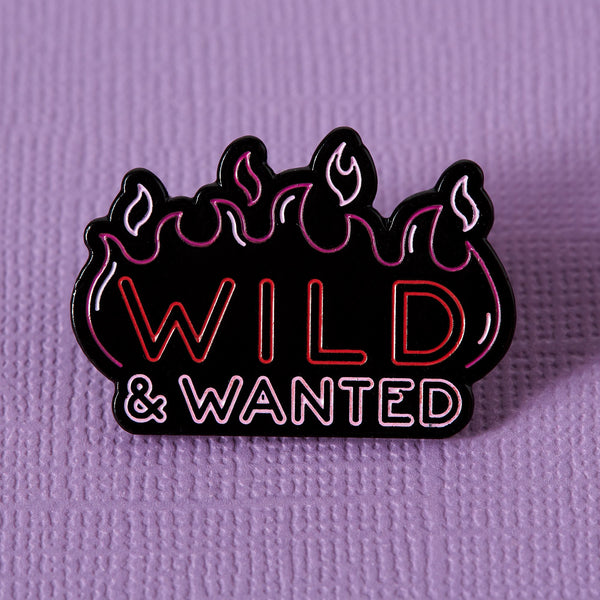 Wild and wanted neon sign pin in soft enamel measures approx 28mm x 25m.